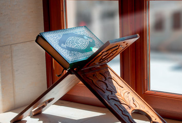 Quran, on wooden table in mosque