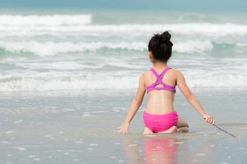 Baby sitting at the beach