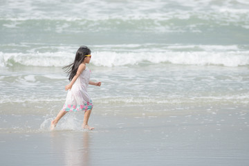 Children walking on the beach
