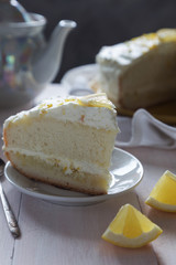 Slice of Lemon sponge cake with cream and zest