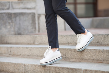 Close up legs of businesswoman walking stepping up stair in modern city, business growth, go up, success, grow up business concept