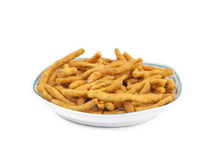 Sev is a popular Indian snack food consisting of small pieces of crunchy noodles made from chickpea flour paste, which are seasoned with turmeric, cayenne, and ajwain before being deep-fried in oil.