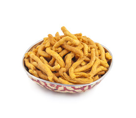 Sev is a popular Indian snack food consisting of small pieces of crunchy noodles made from chickpea flour paste, which are seasoned with turmeric, cayenne, and ajwain before being deep-fried in oil.