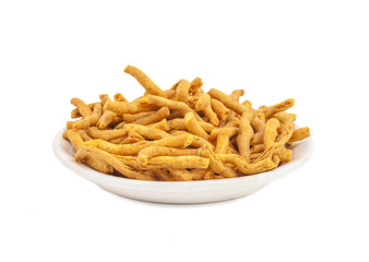 Sev is a popular Indian snack food consisting of small pieces of crunchy noodles made from chickpea flour paste, which are seasoned with turmeric, cayenne, and ajwain before being deep-fried in oil.