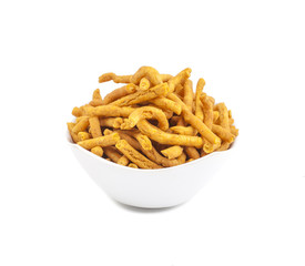 Sev is a popular Indian snack food consisting of small pieces of crunchy noodles made from chickpea flour paste, which are seasoned with turmeric, cayenne, and ajwain before being deep-fried in oil.