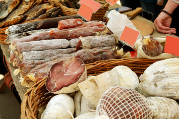 Street life. Counter of the street fair with several varieties dry smoked meat and sausage. Urban...