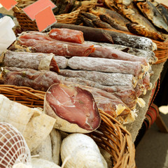 Street life. Counter of the street fair with several varieties dry smoked meat and sausage. Urban...