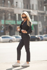 A beautiful young business woman walking outdoors