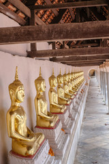 Golden of Buddha statues at Wat Thai Temple worship by sitting concentrate. it's faith of buddhism to pray for god helpful and goodluck in Thailand
