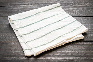 kitchen cloth (napkin) on wood background