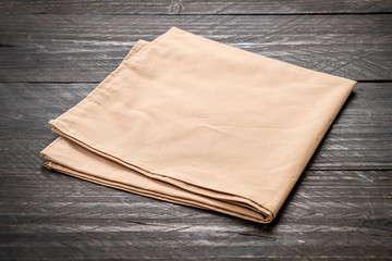kitchen cloth (napkin) on wood background