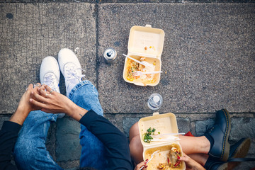 Concept, top view of tourists eating takeaway food on street at Camden market in London