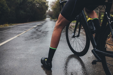 Fototapeta premium Cyclist training on wet road