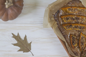 Authentic view of a pumpkin baked with slices of honey and walnuts