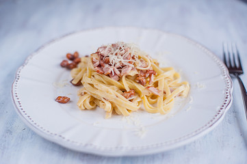 Pasta with ham and nuts.
