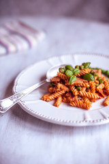 Pasta with tomato paste and basil