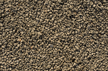 Background image of the small brown and grey rocks