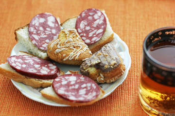 Food on the table. Sandwiches, tea and biscuits