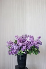 Vase with spring violet lilac flowers © Tetiana