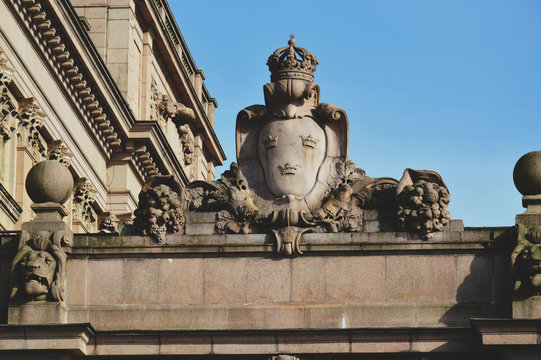 Details of art and decor on Building of The Parliament House of Sweden built in Neoclassical style, with a centered Baroque Revival style facade section in the Gamla stan, old town of Stockholm