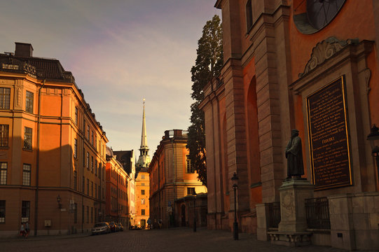 Light and shadow reflects on historic buildings in Gamla Stan, the old town of Stockholm, Sweden