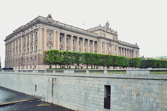 Building of The Parliament House of Sweden built in Neoclassical style, with a centered Baroque Revival style facade section in the Gamla stan, old town of Stockholm
