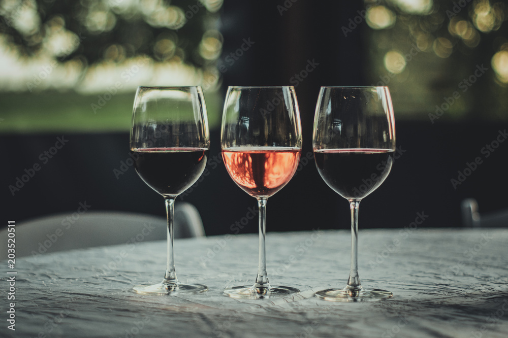 Wall mural three wine glasses on fancy table