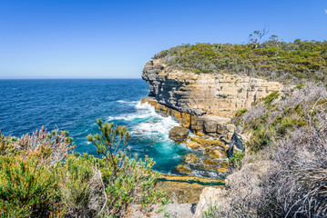 Tasman Peninsula, Tasmania, Australia: Scenic coastline of rocky cliff Tasman arch with old stone...