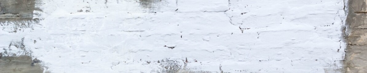 Banner of brick wall with painted splotch for your text and paper scraps as background or texture