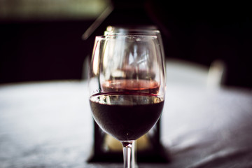 Red Wine Glass Tasting at Winery with Lantern