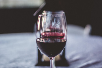 Red Wine Glass Tasting at Winery with Lantern