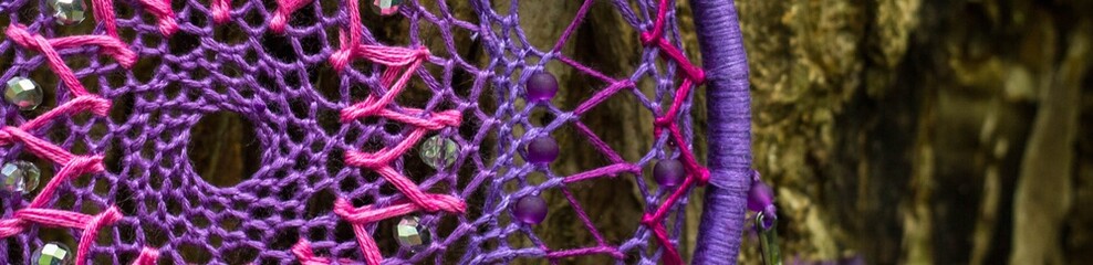 Banner of Dreamcatcher made of feathers, leather, beads, and ropes