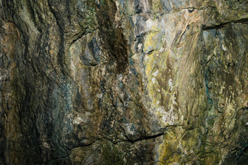 Beautiful cave. View from inside dark dungeon. Textured walls of cave. Background image of underground. Dampness inside cave.