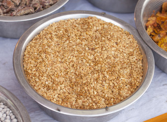 Split Roasted Coriander Seeds also know as Dhana Dal or Sukh Mukh isolated on White Background