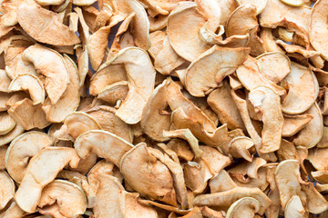 Background of sliced dried apples. Complete filling of the Autumn harvest