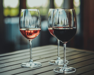 Three Wine Glasses on Wooden Table