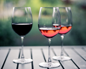 Three Wine Glasses on Wooden Table