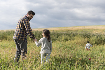 Father and daughter playing outdoors