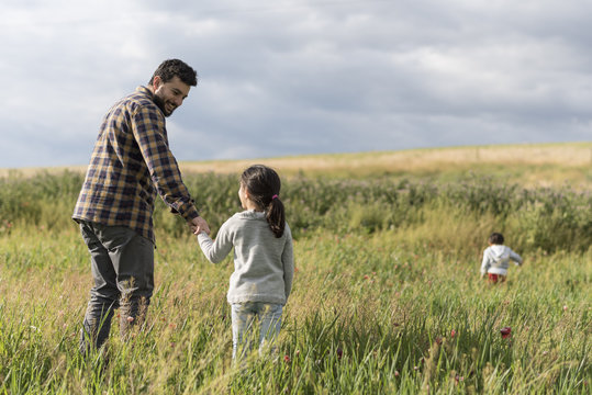 Father and daughter playing outdoors