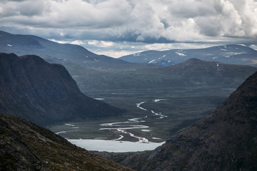 Fototapeta na wymiar A river valley Between mountains in Norway