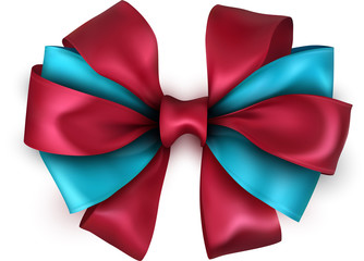 Red and blue satin bow isolated on white.
