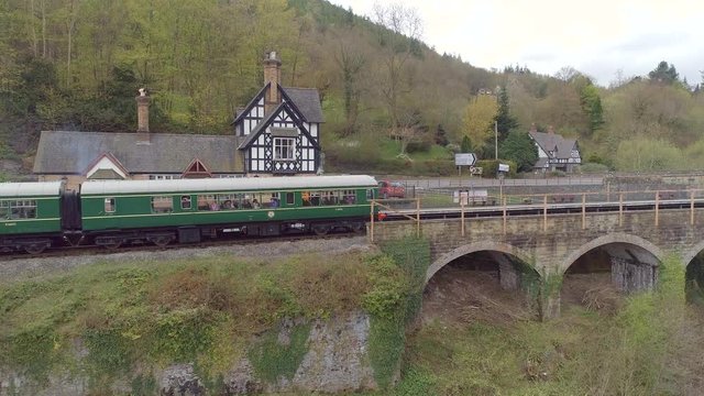 Commuter Train at a Small Train Station in the Countryside