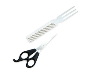 Hairdressing scissors with black handles and a metallic shiny comb on a white background. Close image.