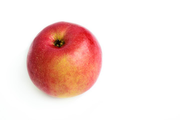 Red organic juicy ripe apple on a white background. Fresh pure fruit.