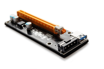Adapter or riser PCI-E for mining on video cards. Device for adaptation 1X PCI-E to 16X slot and add video graphic cards to motherboard. Closeup on white background.