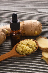 Ginger root essential oil on a dark background