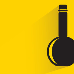 beverage bottle with drop shadow on yellow background