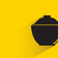 Fototapeta premium cooking pot with shadow on yellow background