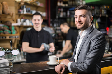 Happy guest in coffee shop