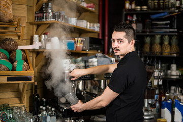 Male barista in the cafe